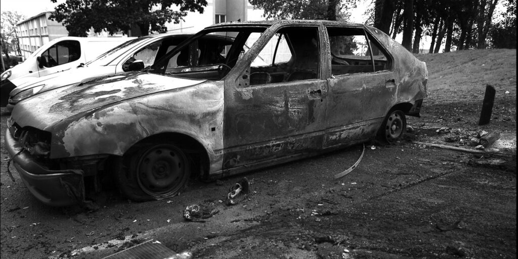 A burnt out car from the urban jungle