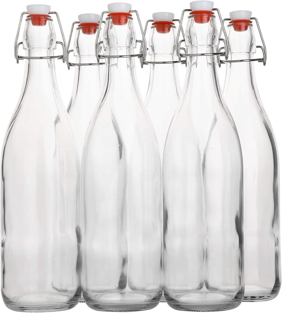 Size clear glass bottles with ceramic stoppers and metal fixtures to seal the stoppers to the bottle.
